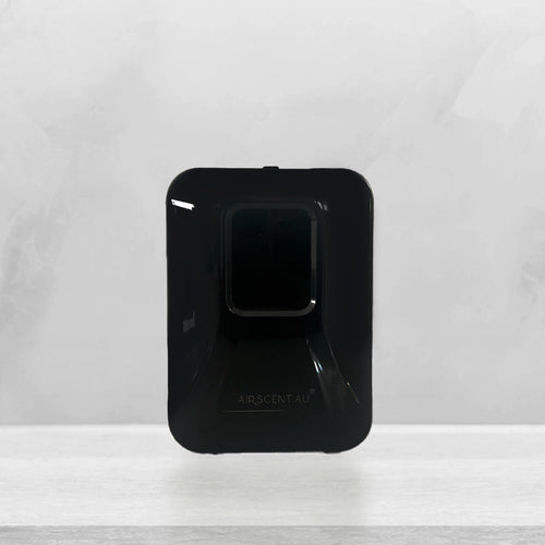 AirScent Xmini compact scent diffuser in black, wall-mountable and app-controlled design
