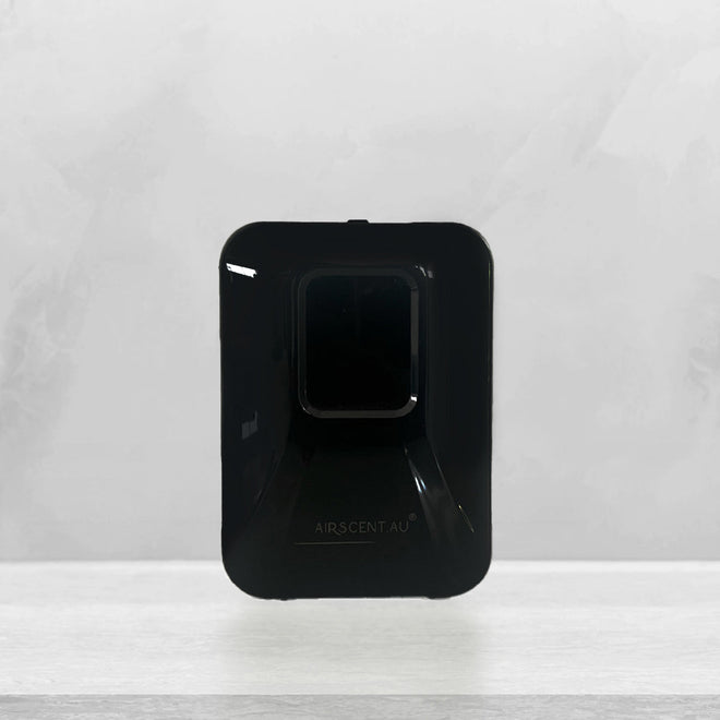 AirScent Xmini compact scent diffuser in black, wall-mountable and app-controlled design
